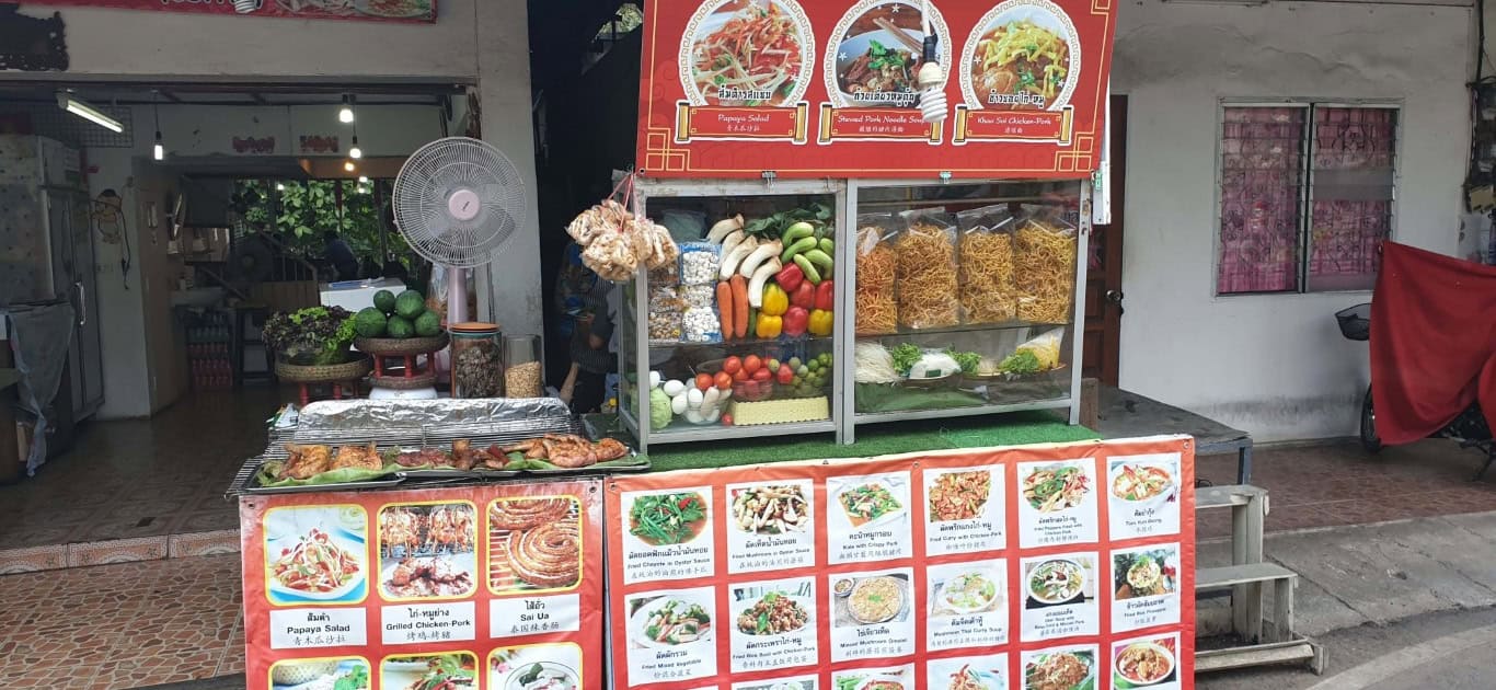a food stand with signs and posters